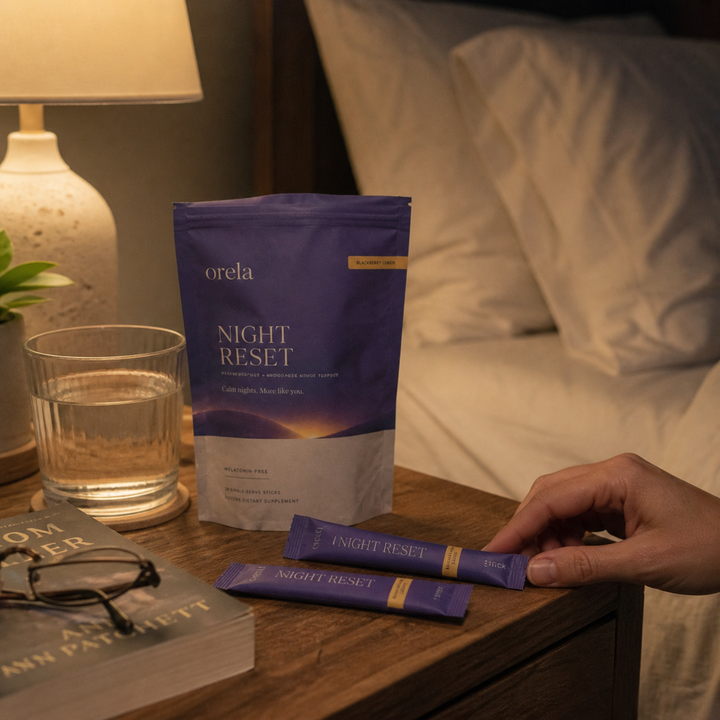 Customer smiling while holding an Orela Night Reset pouch