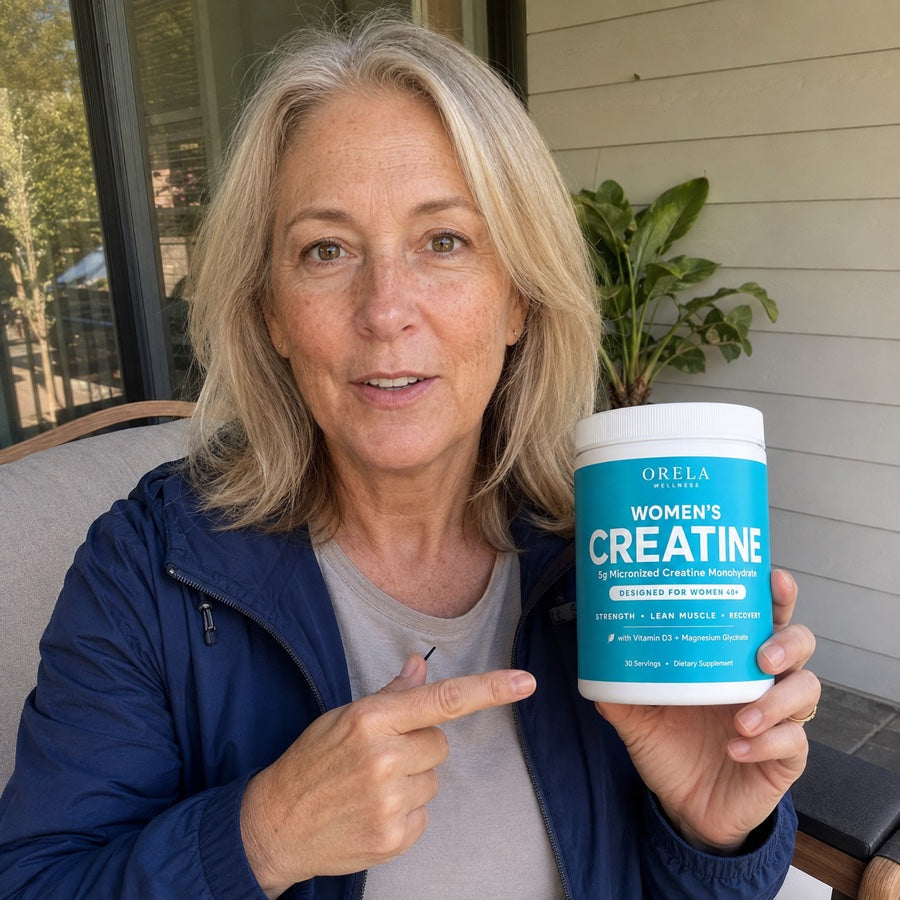 Woman pointing to a jar of Orela Women’s Creatine